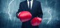 Businessman boxing in rain Royalty Free Stock Photo