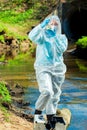 dangerous sewer water, a scientist takes a sample of water in protective