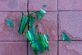 Dangerous shards of glass. Broken bottle on the sidewalk Royalty Free Stock Photo