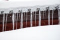 Dangerous sharp icicles and snow hanging from the roof