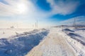 Dangerous snowing road with road signs for driving cars and public transport during blizzard Royalty Free Stock Photo