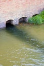 Dangerous toxic polluted water running towards the river