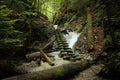 Dangerous trail through a waterfall with wooden ladders in the Slovak Paradise National Park, Slovaki Royalty Free Stock Photo