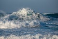 Dangerous wavy ocean with wind waves crashing