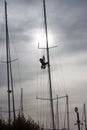 A man working on the mast of a ship Royalty Free Stock Photo