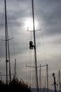 A man working on the mast of a ship Royalty Free Stock Photo
