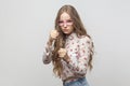 Dangerous young woman in pink eyeglasses, looking at camera and Royalty Free Stock Photo