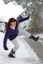 A woman slips on a snowy road