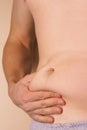 The Dangers of Belly Fat. Obese Man in Jeans Squeeze the Belly F Royalty Free Stock Photo