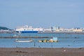 Dangjin harbor at low tide with large cargo ships in background Royalty Free Stock Photo