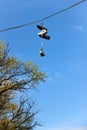 Dangling shoes on telephone wire