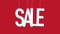 Dangling and wobbling word SALE over bright red background