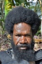 Portrait of Dani Man. A man with a beard from the Papuan tribe Dani.