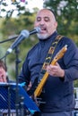 Daniel Jonas of 3yin singing and playing guitar at an annual concert of Jewish Klezmer music in Regent`s Park in London UK.