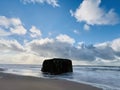 Danish beach section, with bunkers that are slowly being swallowed up by the sea. Royalty Free Stock Photo