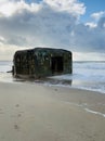 Danish beach section, with bunkers that are slowly being swallowed up by the sea. Royalty Free Stock Photo