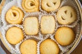 Danish butter cookies close up in the paper packing. Various butter biscuits with sugar on top Royalty Free Stock Photo