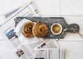 Danish coffee breadroll with coffee and newspaper