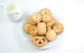 Danish cookies seved with jug of milk on white backgro Royalty Free Stock Photo