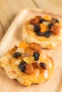 Danish custard with mixed dried fruit on wooden dish