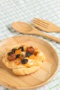 Danish custard with mixed dried fruit on wooden dish