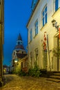 The danish flag and the bell-tower in a narrow alley in Faaborg