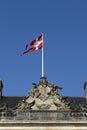 Danish flag flying from the roof of Amalienborg palace