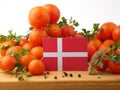 Danish flag on a wooden panel with tomatoes isolated on a white Royalty Free Stock Photo