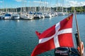 Danish flag in yacht harbour Royalty Free Stock Photo