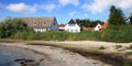 Danish house on coastline in Snogebaek Royalty Free Stock Photo