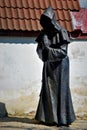 Faceless Monk Statue in upper Old Town. Tallinn. Estonia. Royalty Free Stock Photo