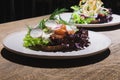 Danish open sandwich smorrebrod with vegetables and herbs.