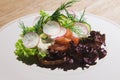 Danish open sandwich smorrebrod with vegetables and herbs.