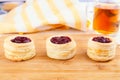 Danish pastry cake with cranberry jam and fresh blueberry and raspberry on the table. Sunny breakfast Royalty Free Stock Photo