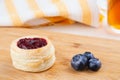 Danish pastry cake with cranberry jam and fresh blueberry on the table. Sunny breakfast Royalty Free Stock Photo