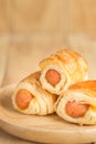 Danish Pastry with sausage on wooden dish Royalty Free Stock Photo