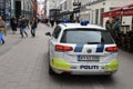 Danish police patrol city with police auto