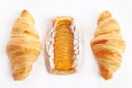 Danish puff with apricot jam and two croissants on a white background. An isolated object. Copy of the space.Top view Royalty Free Stock Photo