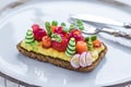 Danish smorrebrod with gravlax and omelet on rye bread Royalty Free Stock Photo