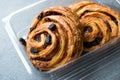 Danish Spiral Cinnamon Raisin Roll / German Pastry Schnecken in Plastic Box / Container.