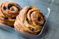 Danish Spiral Cinnamon Raisin Roll / German Pastry Schnecken in Plastic Box / Container.