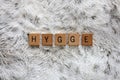 Word Hygge Spelled out with Wooden Letter Blocks on Soft Faux Fur Blanket