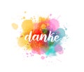 Danke - Thank you in German. Handwritten modern calligraphy watercolor lettering text. Colorful handlettering on watercolor paint Royalty Free Stock Photo