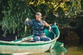 Danube Delta, Romania, May 2018: Fisherman fishing in his boat i Royalty Free Stock Photo