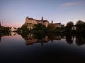 Danube river sunset mirror reflection of medieval fortress castle Schloss Sigmaringen in Baden-Wuerttemberg Germany Royalty Free Stock Photo