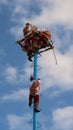 Danza de los voladores de Papantla, one man still climbing up, shown in Playa del Carmen, Mexico