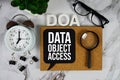 DAO - Data Access Object acronym with alarm clock and magnifying glass, business concept background Royalty Free Stock Photo