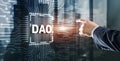 DAO. Decentralized Autonomous Organization. Businessman clicking on virtual screen