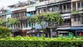 05/10/2020, Dao Khanong, Thailand, Old commercial buildings and messy wires with trees. Royalty Free Stock Photo