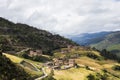 Traditional Tibetan countryside with fields and mountains around Daocheng Royalty Free Stock Photo